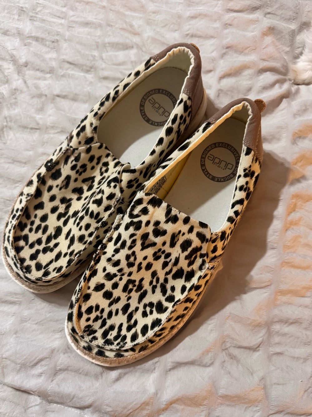 Hey Dude Women's Cheetah Print Wally Slip-Ons in Black and Cream with Brown Heel